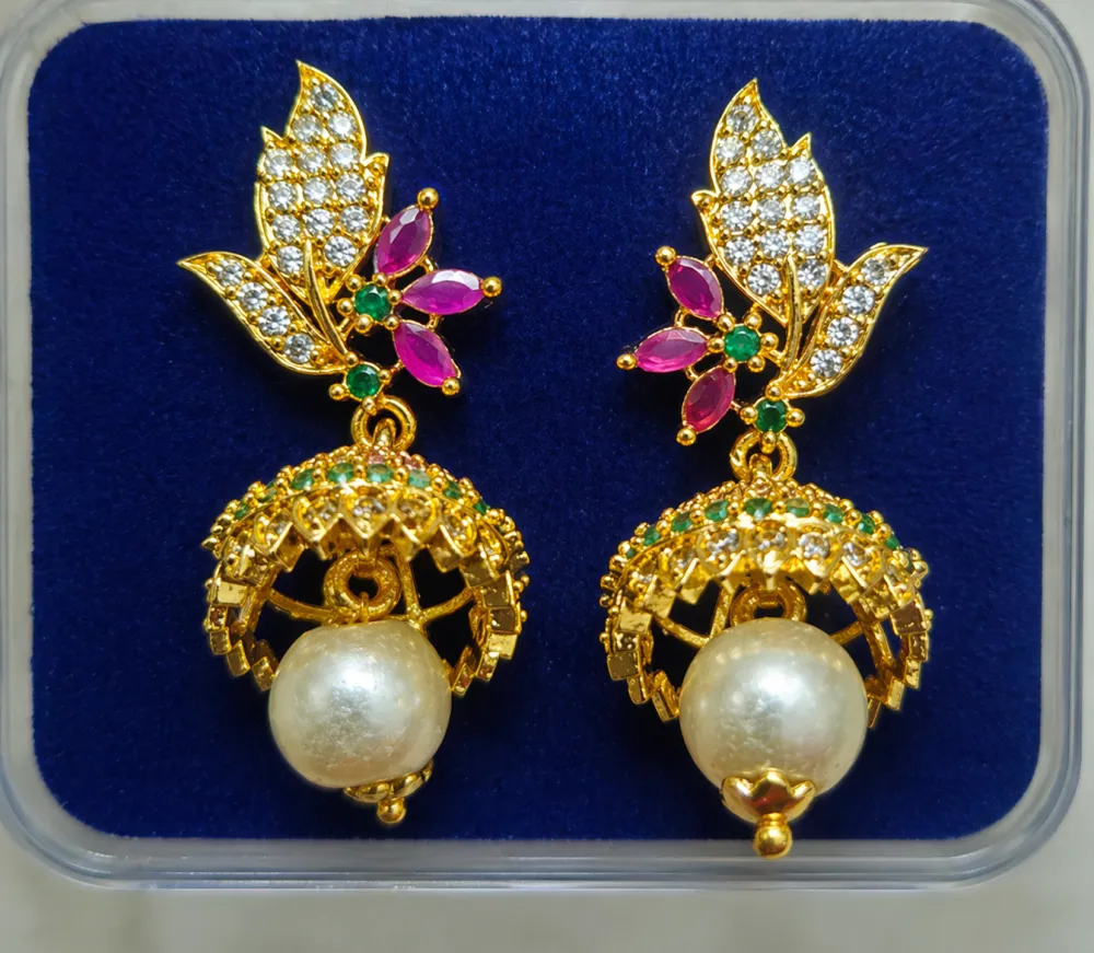 Gold Plated Pearl Jhumka Earrings with Floral Stone Design